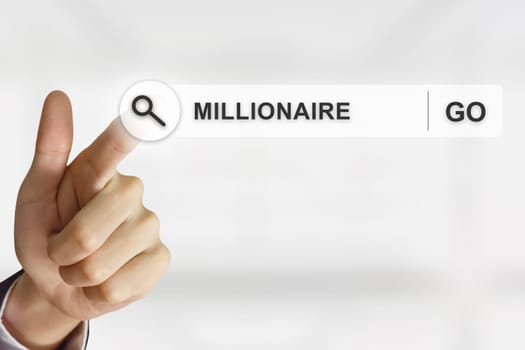 business hand clicking millionaire button on search toolbar with blurred background