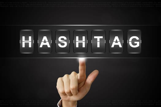 business hand pushing hashtag on Flipboard Display