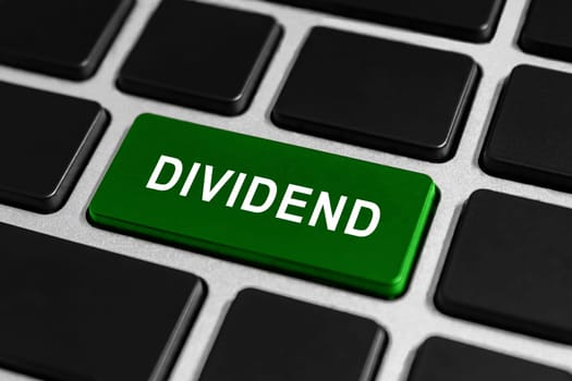 dividend green button on keyboard, business concept