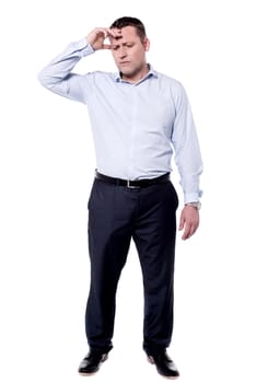 Stressed middle aged man suffering from headache