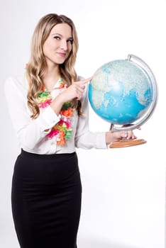 Lady wearing hawaiian garland, holding globe.