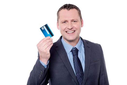 Smiling male entrepreneur showing his credit card