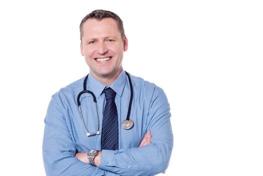 Male doctor posing to camera with folded arms