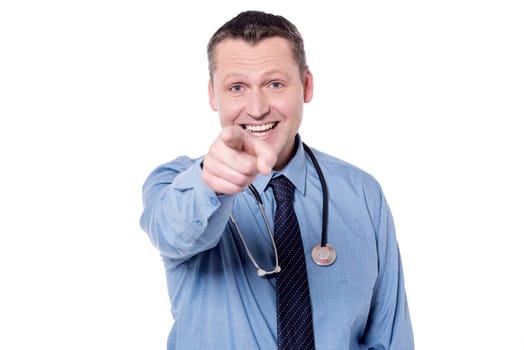 Happy male doctor pointing his index finger towards camera