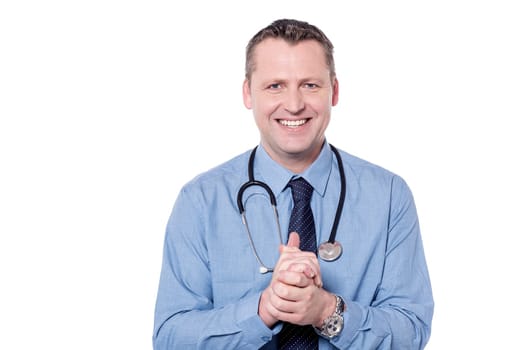Male doctor clasped his hands over white