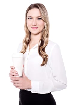 Pretty young lady holding coffee cup over white
