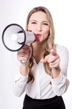 Young woman holding megaphone against white background
