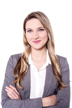 Young pretty woman posing with folded arms to camera
