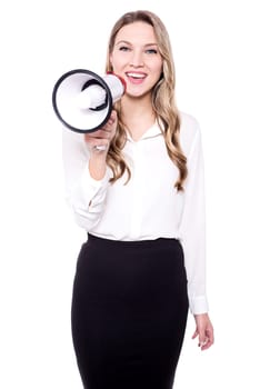 Pretty woman with a megaphone making an announcement