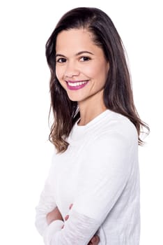 Beautiful young woman with crossed arms over white