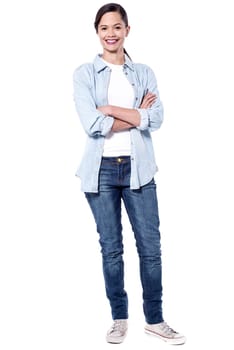 Full length image of Confident woman posing casually
