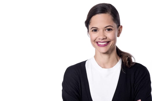 Beautiful smiling woman posing over white in studio