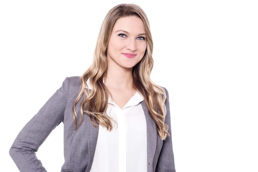 Smiling young woman posing to camera over white background