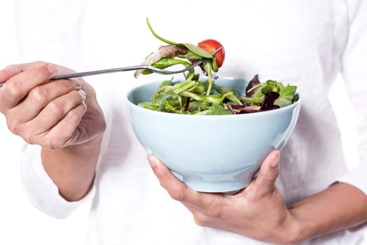 Cropped image of a female holding a bowl of green salad