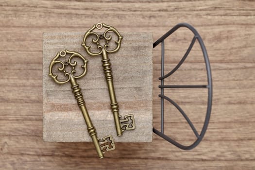 antique key with small toy chair