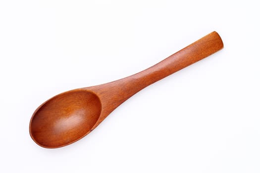 wooden spoon isolated on wood background