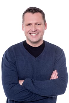 Close up shot of happy man with crossed arms