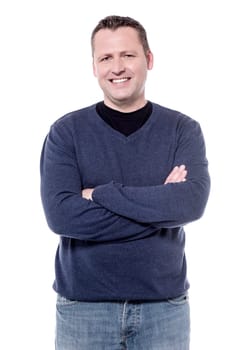 Casual middle aged man posing with folded arms