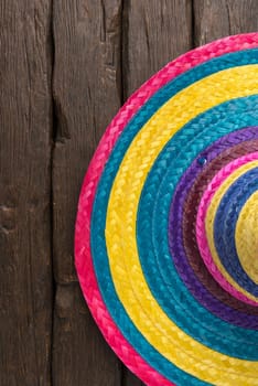 Mexican sombrero on old dark wood background.