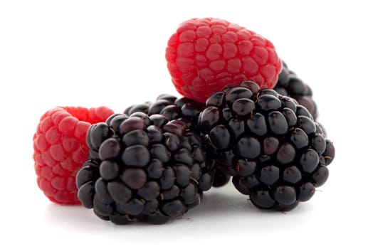 Raspberry with blackberry on white background.