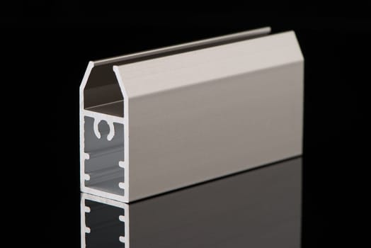 Aluminium profile sample isolated on black background.