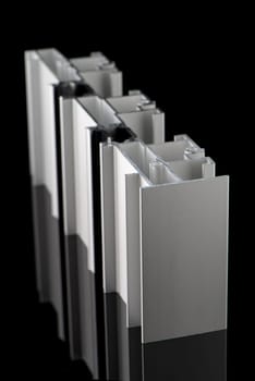 Aluminium profile sample isolated on black background.