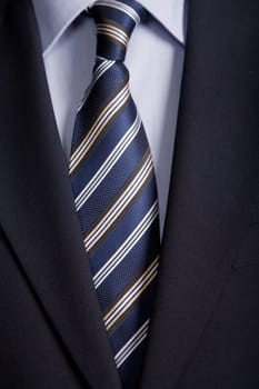 detail of a business man suit with blue tie
