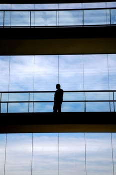 worker inside the modern building in silhouette