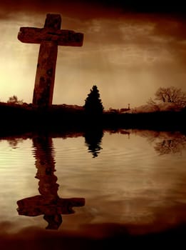 cross silhouette and the clouds at sunset