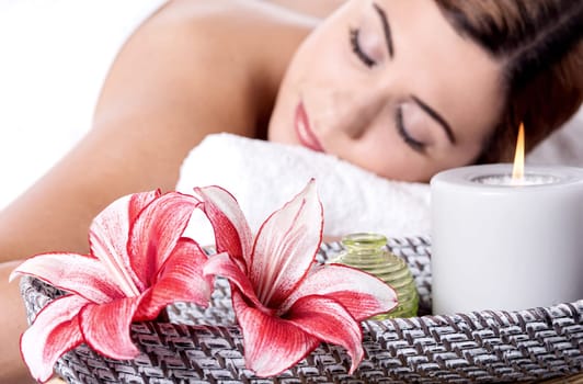 Beautiful woman relaxing in spa with closed eyes