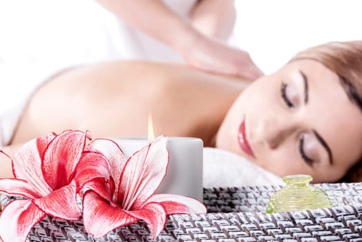 Attractive caucasian woman lying down and getting massage