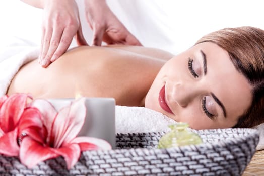 Beautiful young woman relaxing with hand massage
