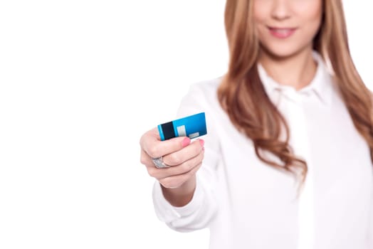 Cropped image of a pretty woman showing debit card