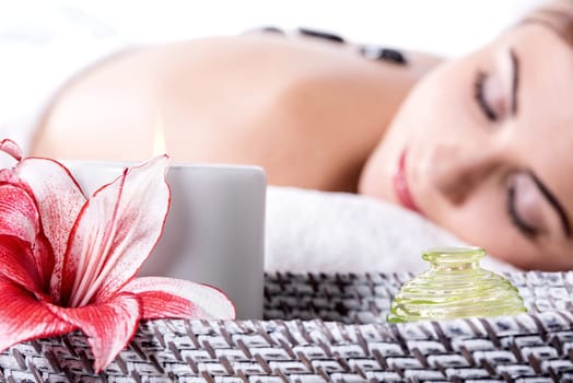 Pretty woman receiving a therapy with hot stones