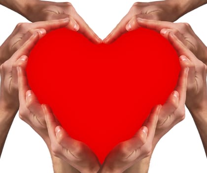 Hands arranged around a red heart shape. Love concept