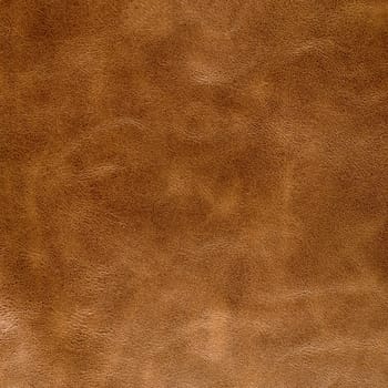 Brown leather texture closeup background.