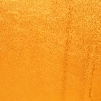 Closeup on yellow leather background.