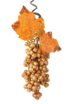 Christmas decoration simulating a bunch of golden grapes isolated on white background.