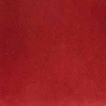 Red leather texture closeup detailed background.