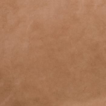 Brown leather texture closeup background.