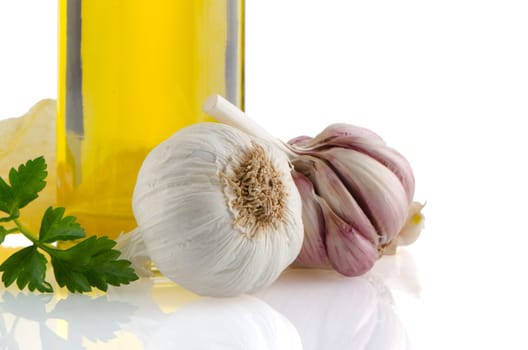 Garlic and olive oil still life rotating isolated on white background. and olive oil isolated on white background.