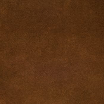 Brown leather texture closeup background.