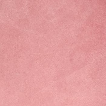 Closeup on cracked pink leather texture background.