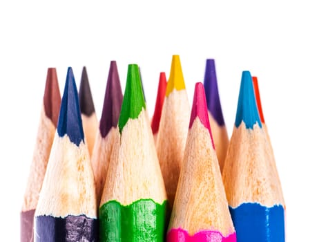 close up of coloured pencil tips on white background