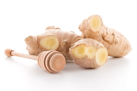 Ginger root and drizzler isolated on white background.
