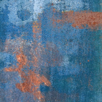 Rusty steel plate with blue paint residues