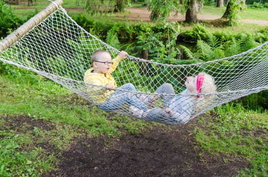 Children swinging in a hammock