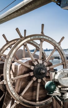 Steering wheel of an old sailing vessel, close up