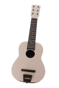 Beige guitar toy isolated on white background.