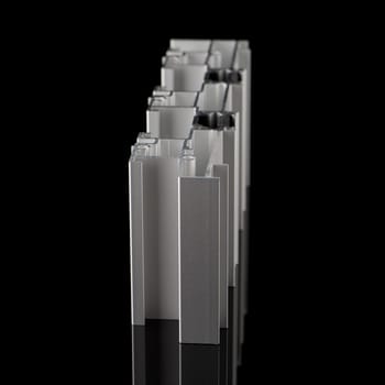Aluminium profile sample isolated on black background.